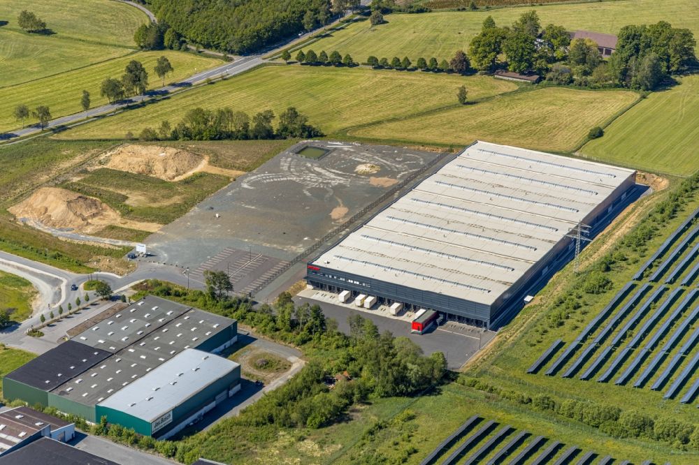 Meschede from above - Construction site to build a new building complex on the site of the logistics center of Briloner Leuchten GmbH & Co. KG Am Steinbach in Meschede in the state North Rhine-Westphalia, Germany
