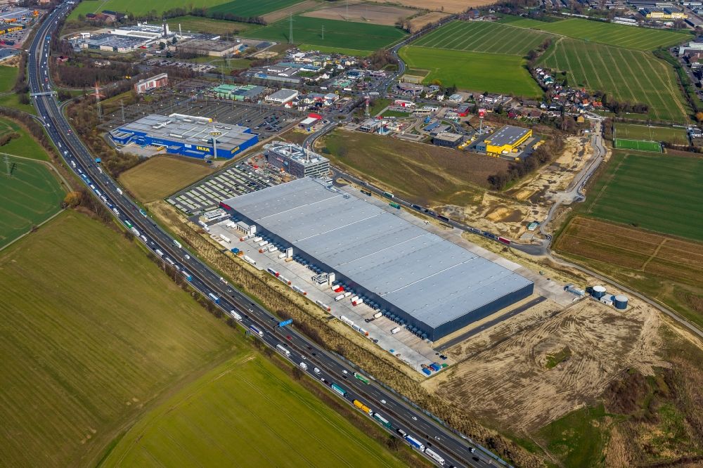 Aerial photograph Kamen - New construction of a building complex on the premises of the logistics center of Woolworth GmbH in the inter-communal commercial area on the Kamen Karree in Kamen in the state North Rhine-Westphalia, Germany
