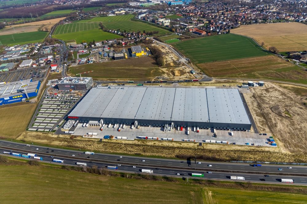 Kamen from above - New construction of a building complex on the premises of the logistics center of Woolworth GmbH in the inter-communal commercial area on the Kamen Karree in Kamen in the state North Rhine-Westphalia, Germany