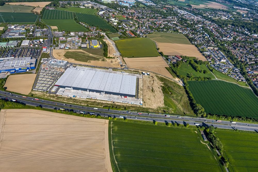 Aerial image Kamen - New construction of a building complex on the premises of the logistics center of Woolworth GmbH in the inter-communal commercial area on the Kamen Karree in Kamen in the state North Rhine-Westphalia, Germany