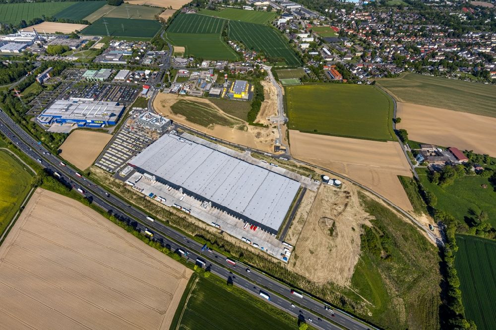 Aerial photograph Kamen - New construction of a building complex on the premises of the logistics center of Woolworth GmbH in the inter-communal commercial area on the Kamen Karree in Kamen in the state North Rhine-Westphalia, Germany