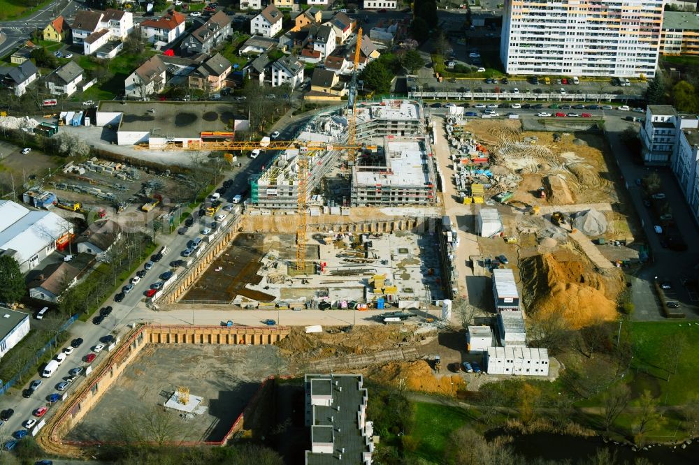 Aerial photograph Nieder-Eschbach - Construction site for the construction of an apartment building and student residence on the Ben-Gurion-Ring in Nieder-Eschbach in the state of Hesse, Germany