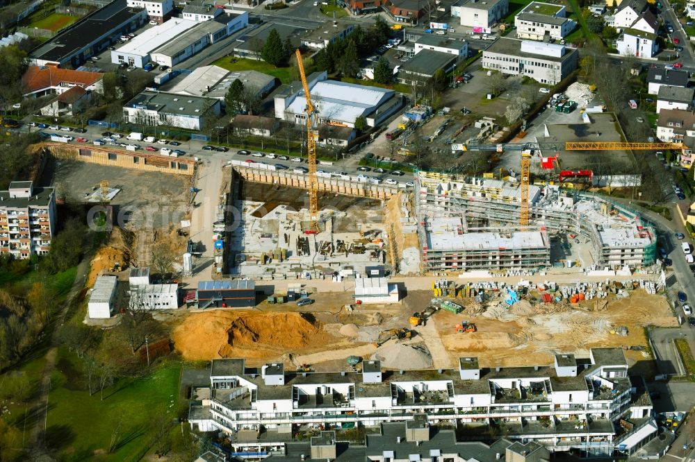 Aerial photograph Nieder-Eschbach - Construction site for the construction of an apartment building and student residence on the Ben-Gurion-Ring in Nieder-Eschbach in the state of Hesse, Germany