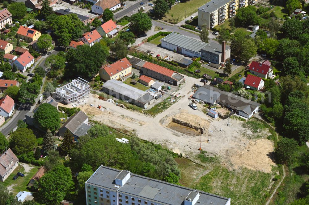 Berlin from above - Construction site to build a new multi-family residential complex Wartenberger Anger on street Dorfstrasse in the district Wartenberg in Berlin, Germany