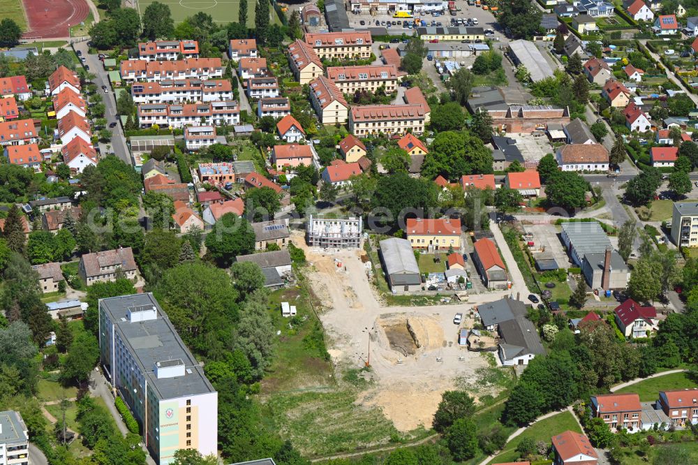 Berlin from the bird's eye view: Construction site to build a new multi-family residential complex Wartenberger Anger on street Dorfstrasse in the district Wartenberg in Berlin, Germany