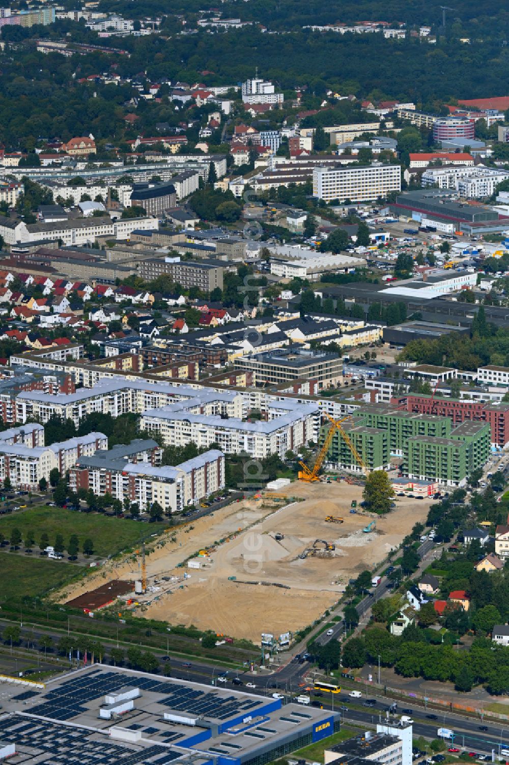 Berlin from the bird's eye view: Construction site to build a new multi-family residential complex Weisse Taube between Ferdinand-Schultze-Strasse, Plauener Strasse and Landsberger Allee in the district Hohenschoenhausen in Berlin, Germany