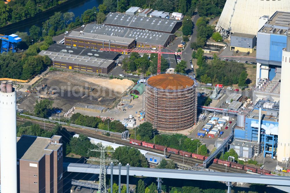 Berlin from above - Construction site for the new construction of a retention basin and water storage tank - heat storage tank on the premises of the Reuter West combined heat and power plant in the district of Siemensstadt in the district Siemensstadt in Berlin, Germany