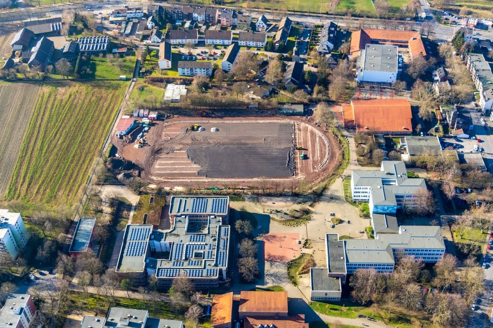Bochum from the bird's eye view: Construction of new Ensemble of sports grounds with renovation works on Passweg overlooking the school buildings of the Maria-Sibylla-Merian-Gesamtschule and the Hellweg-Schule Staedt. Gymnasium in the district Westenfeld in Bochum in the state North Rhine-Westphalia, Germany