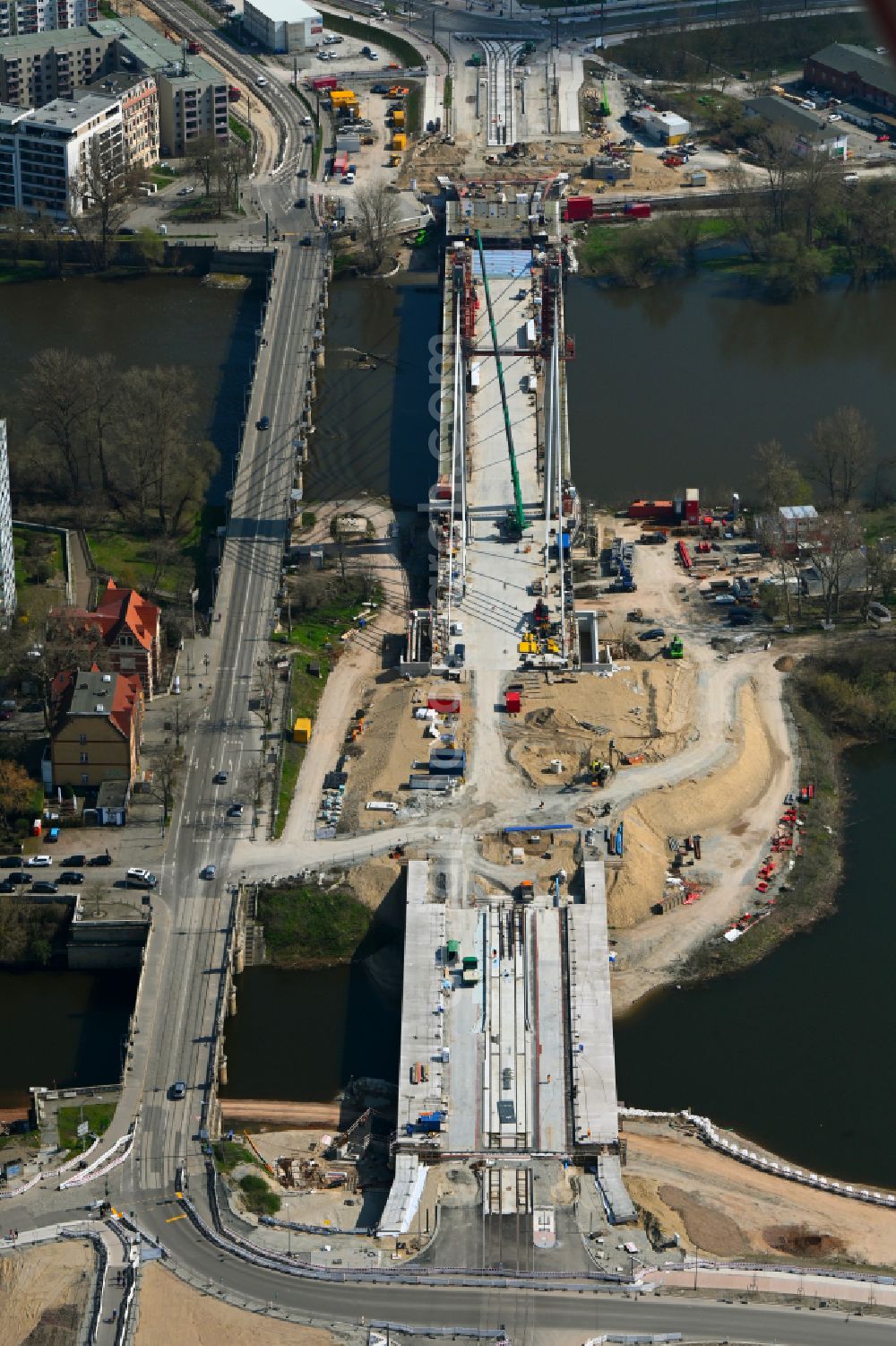 Magdeburg from the bird's eye view: Construction site for the new construction of the road bridges - route and routing of the replacement power bridge train as a pylon bridge named Kaiser-Otto-Bridge and Queen-Editha-Bridge over the Zollelbe and the Alte Elbe on the Mittelstrasse in the district Werder in Magdeburg in the state Saxony- Anhalt, Germany