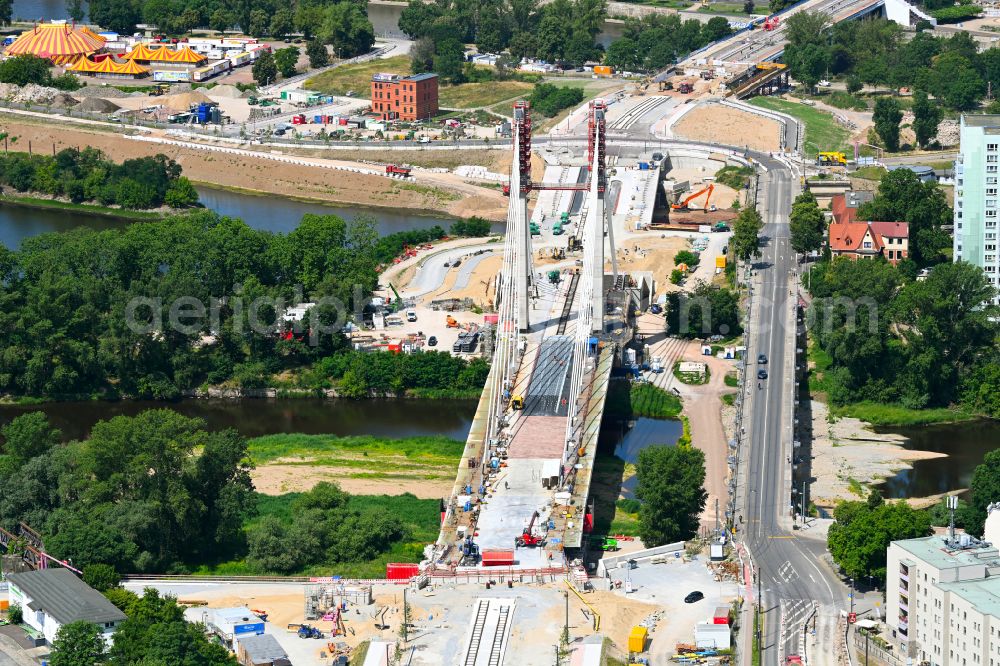Aerial photograph Magdeburg - Construction site for the new construction of the road bridges - route and routing of the replacement power bridge train as a pylon bridge named Kaiser-Otto-Bridge and Queen-Editha-Bridge over the Zollelbe and the Alte Elbe on the Mittelstrasse in the district Werder in Magdeburg in the state Saxony- Anhalt, Germany