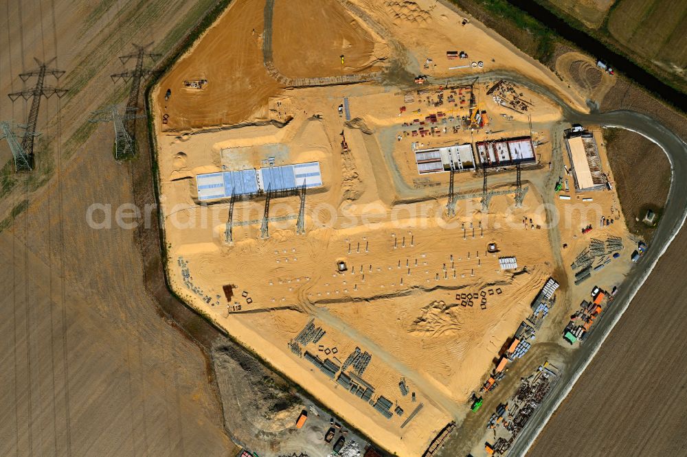 Aerial photograph Grevenkop - Construction site area for the new construction of the substation for voltage conversion and electrical power supply in the district Krempe in Grevenkop in the state Schleswig-Holstein, Germany