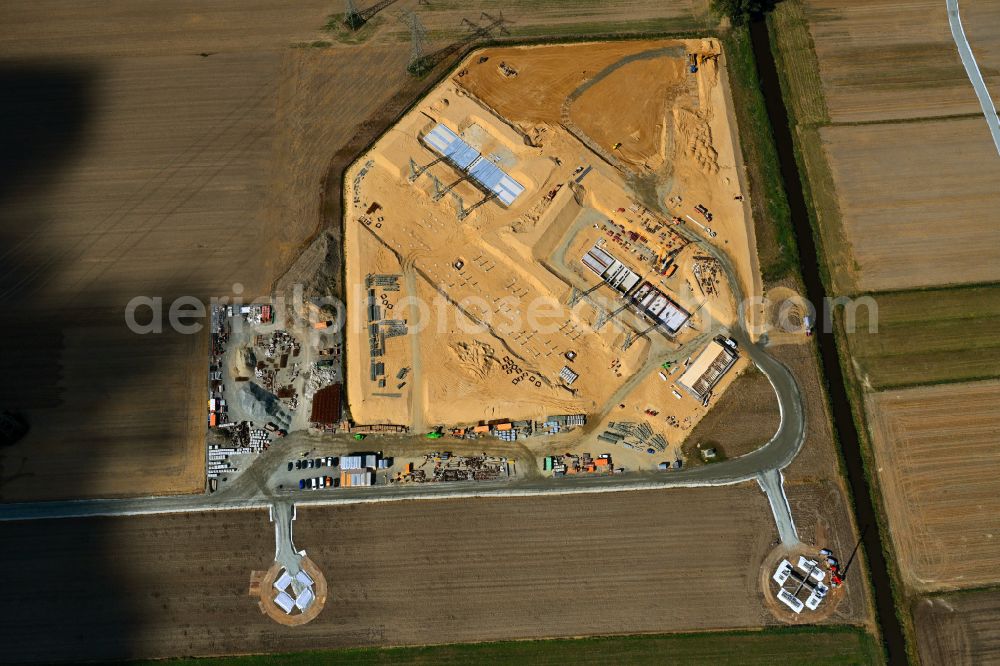 Grevenkop from the bird's eye view: Construction site area for the new construction of the substation for voltage conversion and electrical power supply in the district Krempe in Grevenkop in the state Schleswig-Holstein, Germany