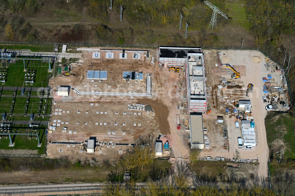 Halle (Saale) from the bird's eye view: Construction site area for the new construction of the substation for voltage conversion and electrical power supply on street Schieferstrasse - Eislebener Chaussee in the district Gewerbegebiet Neustadt in Halle (Saale) in the state Saxony-Anhalt, Germany