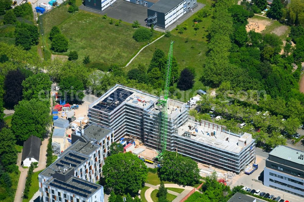 Bielefeld from the bird's eye view: Complementary new construction site on the campus-university building complex of the Universitaet Bielefeld on Morgenbreede in Bielefeld in the state North Rhine-Westphalia, Germany