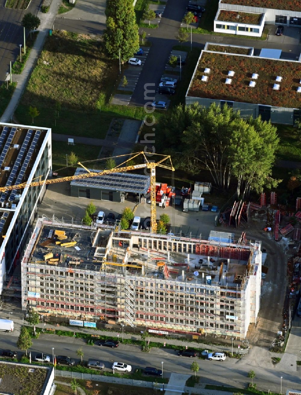 Berlin from above - New construction of the company administration building of BAUER Elektroanlagen Holding GmbH on Karl-Ziegler-Strasse in the district Johannisthal in Berlin, Germany