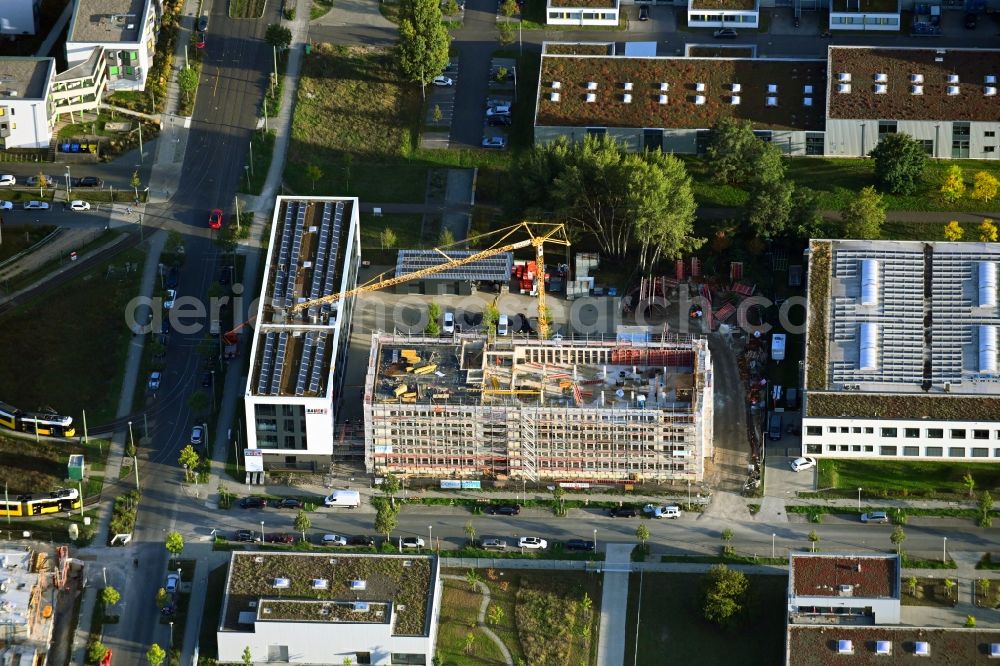 Berlin from the bird's eye view: New construction of the company administration building of BAUER Elektroanlagen Holding GmbH on Karl-Ziegler-Strasse in the district Johannisthal in Berlin, Germany