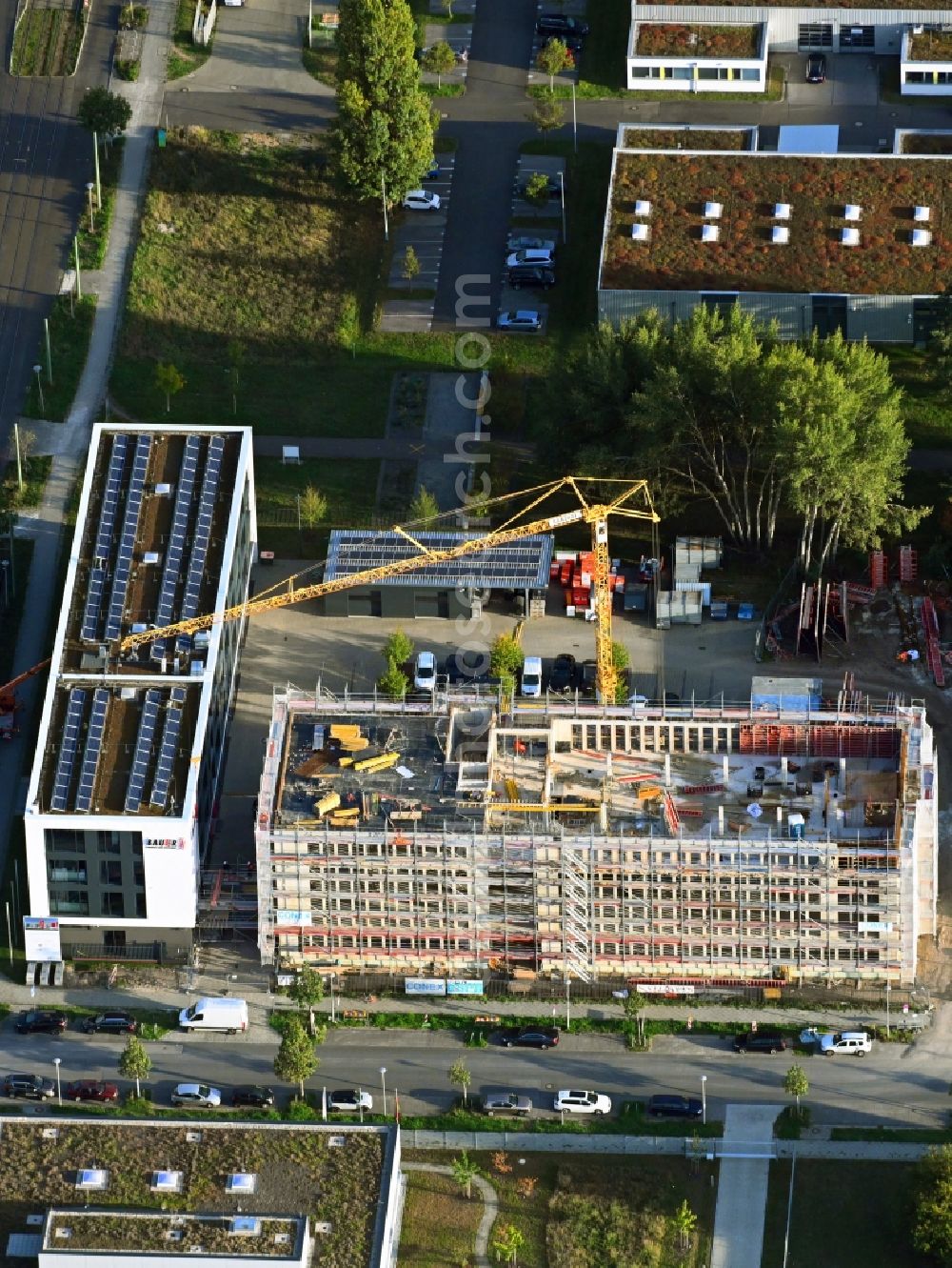 Aerial image Berlin - New construction of the company administration building of BAUER Elektroanlagen Holding GmbH on Karl-Ziegler-Strasse in the district Johannisthal in Berlin, Germany