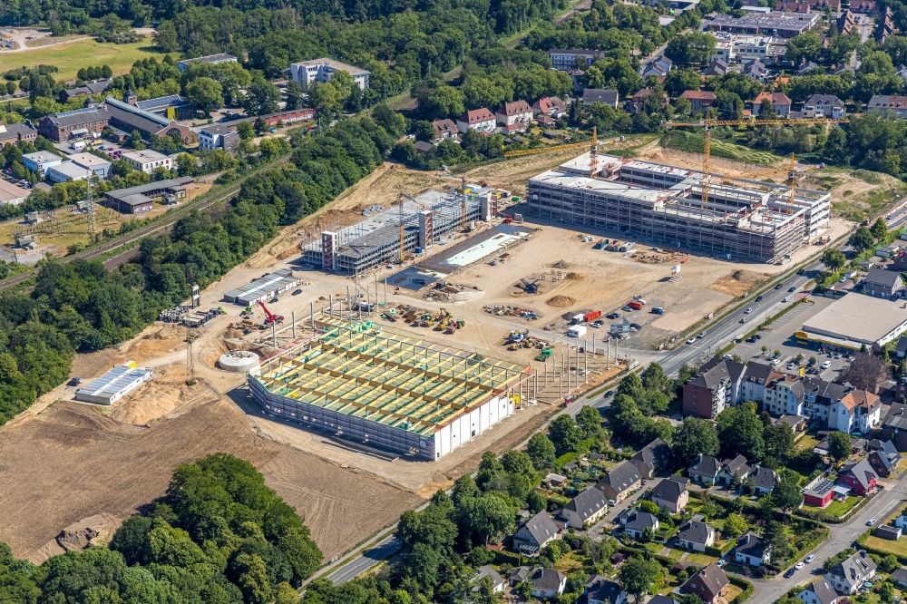 Moers from the bird's eye view: New construction of the company administration building of EDEKA Handelsgesellschaft Rhein-Ruhr mbH on Rheinberger Strasse in the district Repelen in Moers in the state North Rhine-Westphalia, Germany