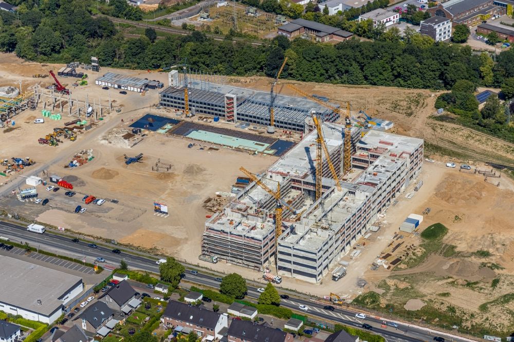 Moers from the bird's eye view: New construction of the company administration building of EDEKA Handelsgesellschaft Rhein-Ruhr mbH on Rheinberger Strasse in the district Repelen in Moers in the state North Rhine-Westphalia, Germany
