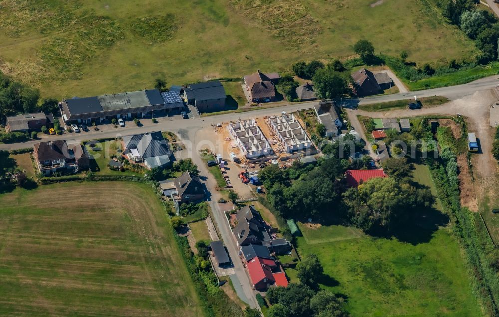 Aerial photograph Nordstrand - Construction site for a new residential and commercial building in the village of England in Nordstrand Nordfriesland in the state Schleswig-Holstein, Germany