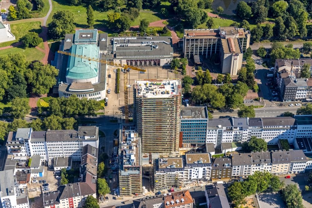 Aerial photograph Essen - Construction site to build a new residential and commercial building HQE Huyssen Quartier Essen with residential tower and senior citizens' apartments on Huyssenallee - corner of Heinrichstrasse in Essen in the Ruhr area in the state North Rhine-Westphalia, Germany