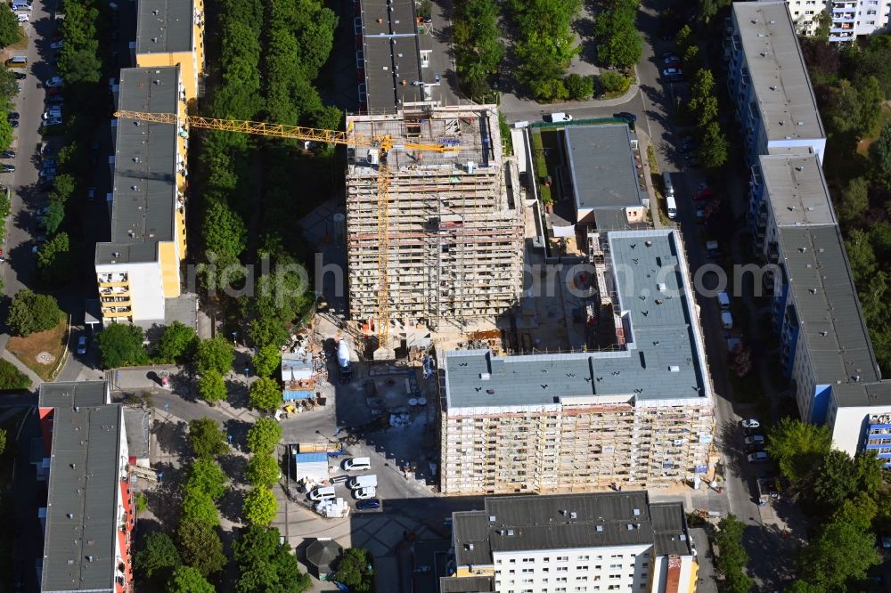 Berlin from the bird's eye view: Construction site for the new residential and commercial building on Kastanienboulevard - Auerbacher Ring - Schneeberger Strasse in the district Hellersdorf in Berlin, Germany