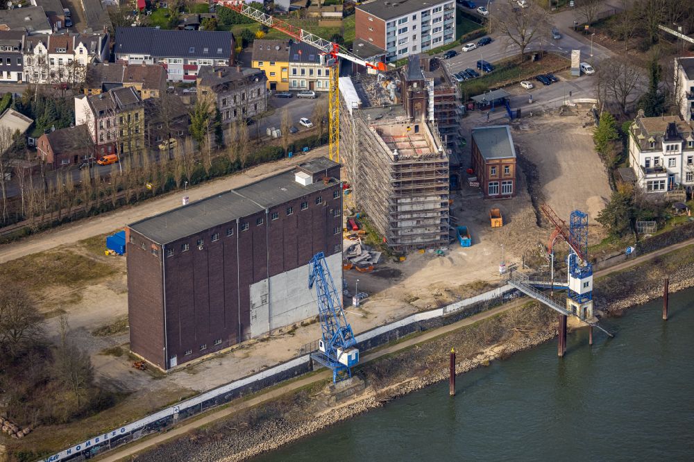 Duisburg from the bird's eye view: Construction site for the new residential and commercial building district Plangemuehle on the river Rhine in Alt-Homberg in the Ruhr area in the state of North Rhine-Westphalia, Germany