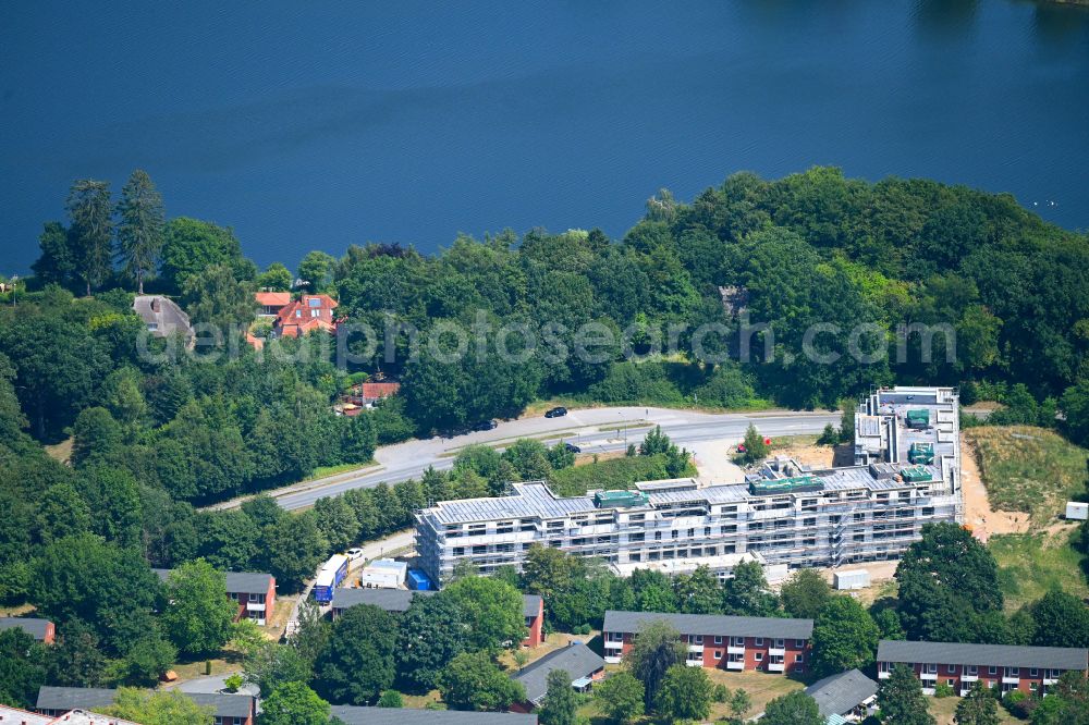 Aerial photograph Eutin - Construction site of a new residential area of the terraced housing estate Wilhelmshoehe on Convivo-Park on street Malenter Landstrasse in the district Fissau in Eutin in the state Schleswig-Holstein, Germany