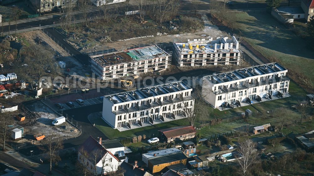 Aerial photograph Werneuchen - Construction site of a new residential area of the terraced housing estate Landsberger Strasse corner Wegendorfer Strasse in Werneuchen in the state Brandenburg, Germany