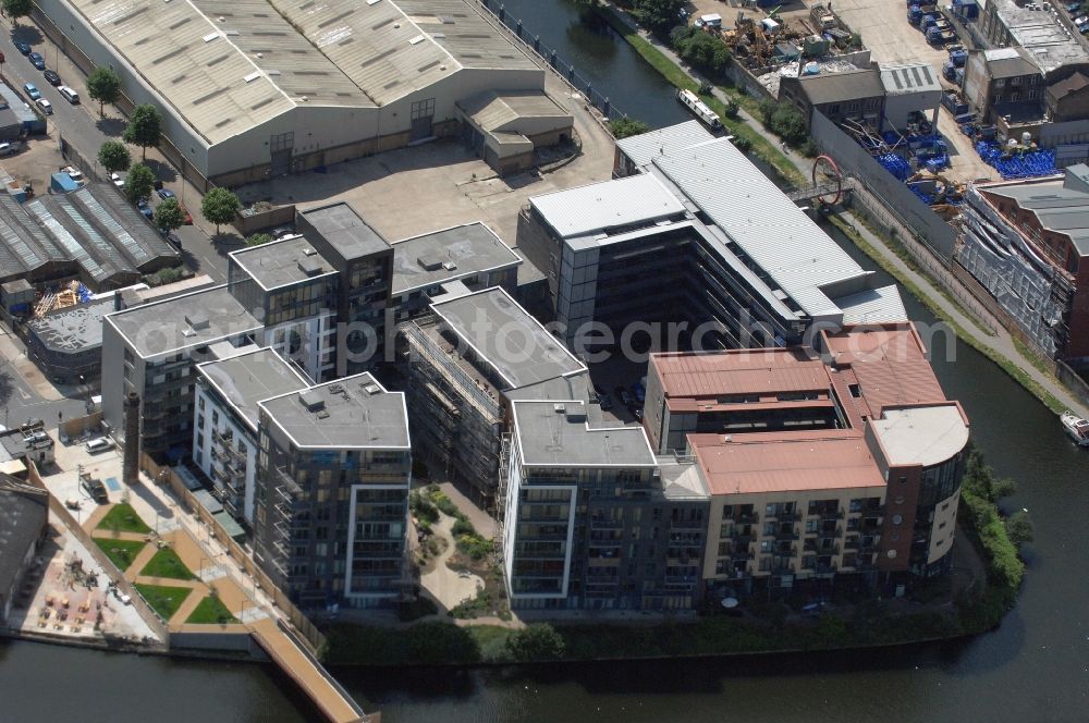 Aerial image London - View of a newly built block of rental flats and condominiums Omega Works developement reclaimed industrial land at the Roach Road in the borough of Hackney in London in the United Kingdom. Responsible for rental and sale is the company Charles Hamilton Estates