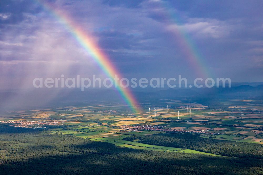 Freckenfeld from the bird's eye view: Precipitation conditions with double rainbow formation over the Bienwald in Freckenfeld in the state Rhineland-Palatinate, Germany
