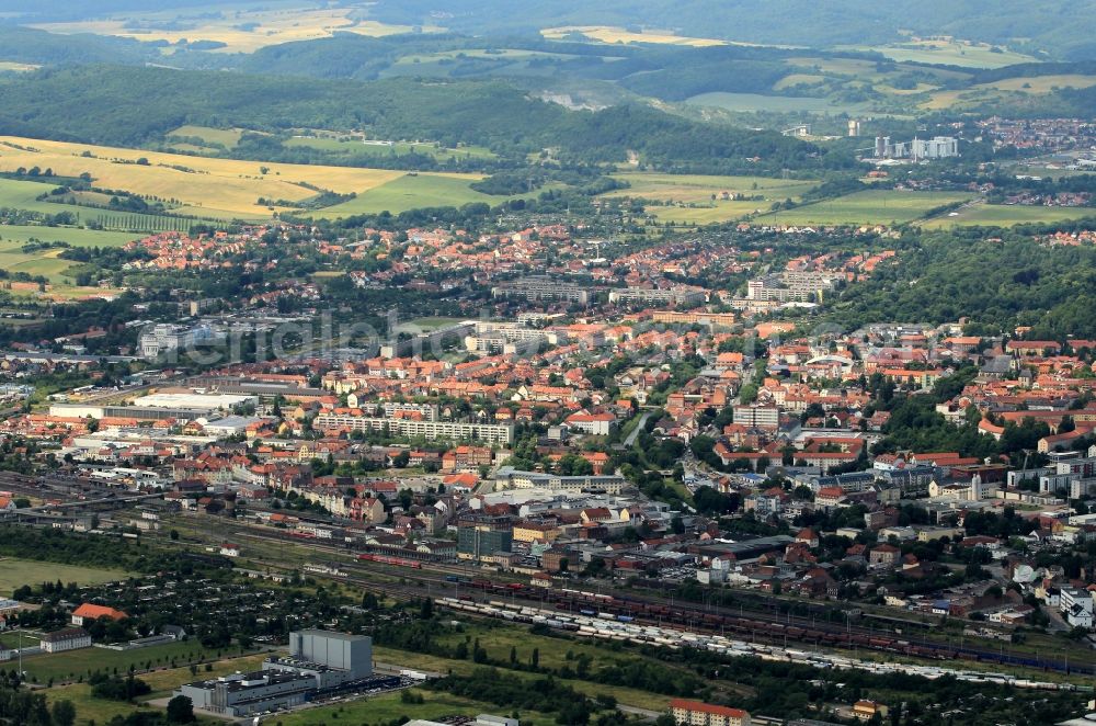 Aerial image Nordhausen - The views of Nordhausen in Thuringia goes from the streets around the station with the Job Center of the Agency for work on the Uferstrasse to the new housing Justus Jonas-road up to the workshops of the former IFA-engine plant on the western outskirts of Nordhausen. In the background are on the southern slopes of the Harz mountain of the quarry and industrial facilities of the Harz Anhydritwerk GmbH can be seen