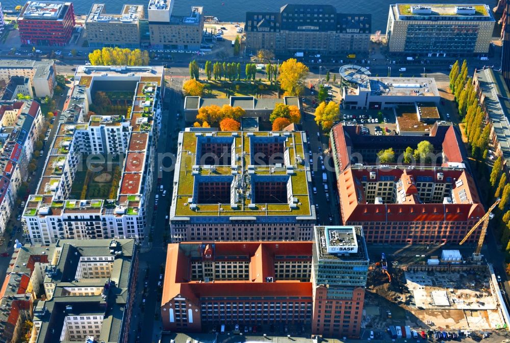 Berlin from the bird's eye view: View at the restored building of the monument protected former Osram respectively Narva company premises Oberbaum City in the district Friedrichshain in Berlin. Here, among many other companies, BASF Services Europe, the German Post Customer Service Center GmbH and Heineken Germany GmbH are located. It is owned by HVB Immobilien AG, which is part of the UniCredit Group