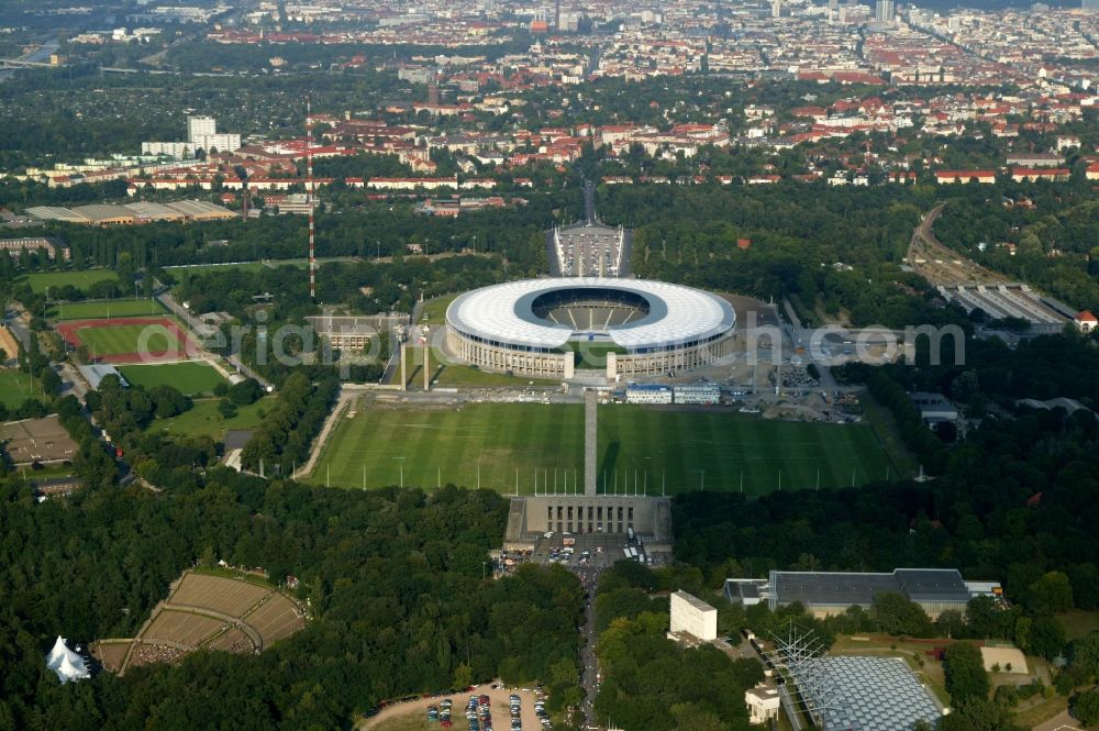 Berlin from the bird's eye view: The Olympic Park Berlin in Berlin-Charlottenburg consists of a number of listed sports and leisure facilities, as well as other structures. These include the Olympic Stadium, the Swimming Stadium, the May Field, the Langemarckhalle, the bell tower, the Olypische place, the frieze tower, the tower of Saxony, the Frankenturm and the Swabian tower