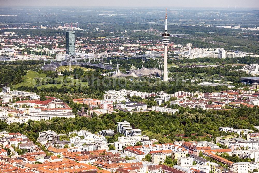 München from above - Olympic Park with Olympic Lake, Olympic Hall and Olympic Tower, student city and BMW grounds in Munich in the state of Bavaria. The famous landmarks characterize the cityscape in the district of Milbertshofen