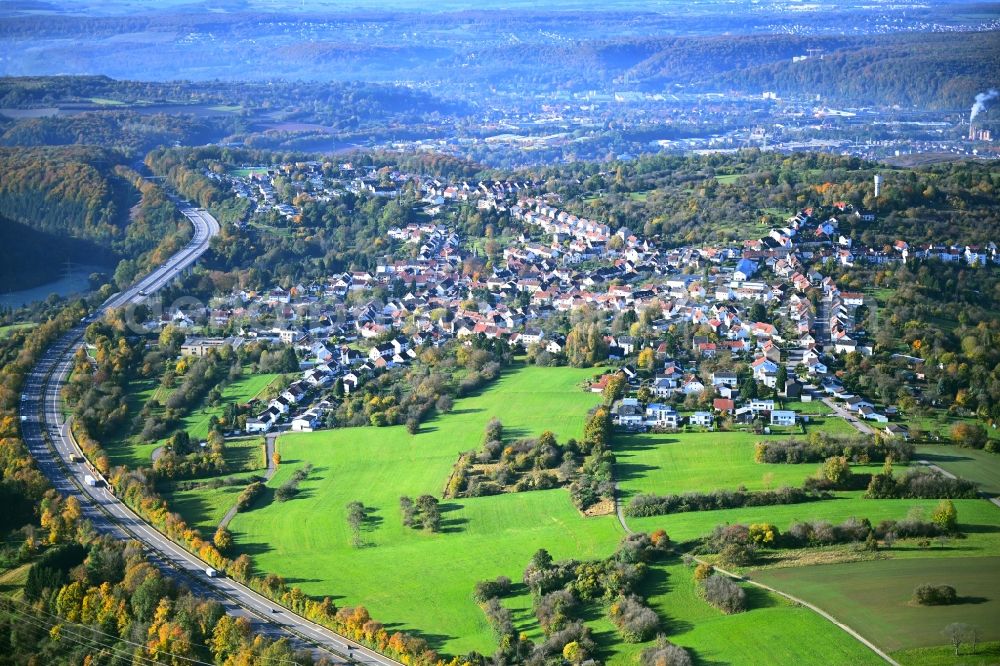 Bischmisheim from above - Town view of the streets and houses of the residential areas along the course of the motorway BAB A6 in Bischmisheim in the state Saarland, Germany
