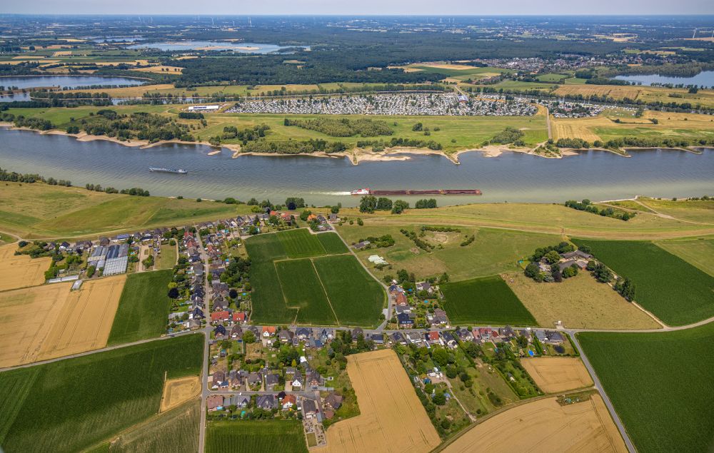Wesel from above - City view of the streets and houses of the residential areas surrounded by agricultural areas in Buederich on the river Rhine in the Ruhr area in the state of North Rhine-Westphalia, Germany