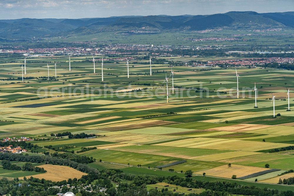 Herxheimweyher from above - City view Uebersicht of Felof bai with silhouette of a group of wind power plants in Herxheimweyher in the state Rhineland-Palatinate, Germany