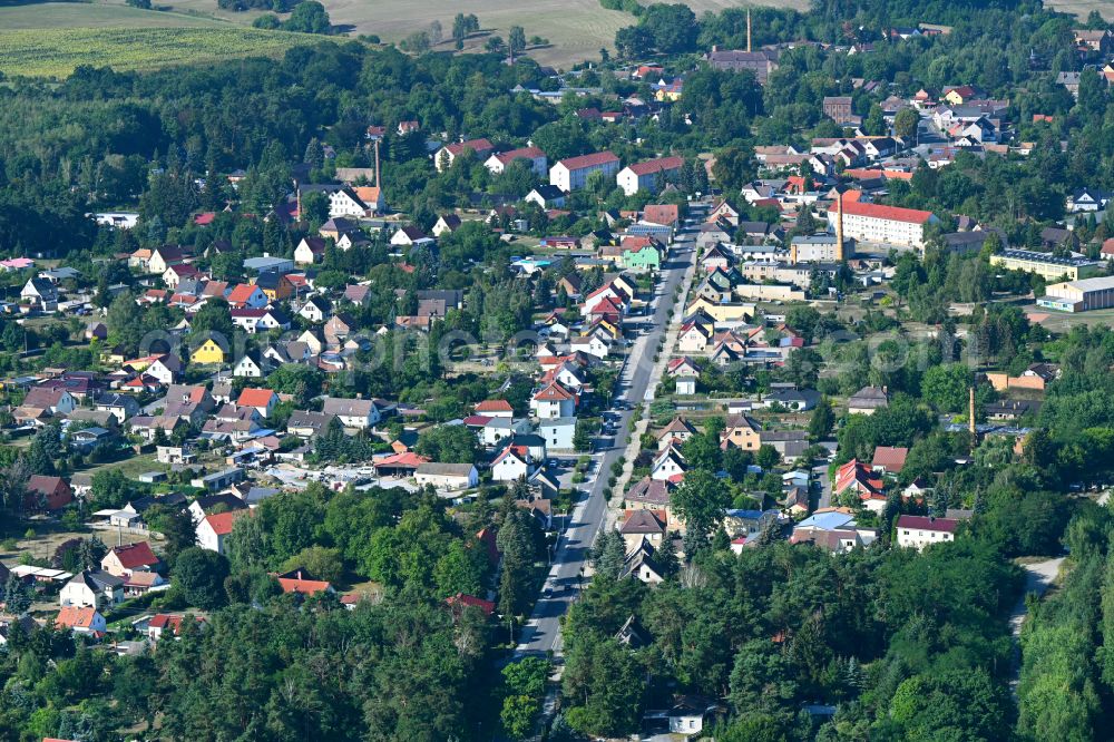 Crinitz from above - Town View of the streets and houses of the residential areas along the main street in Crinitz in the state Brandenburg, Germany