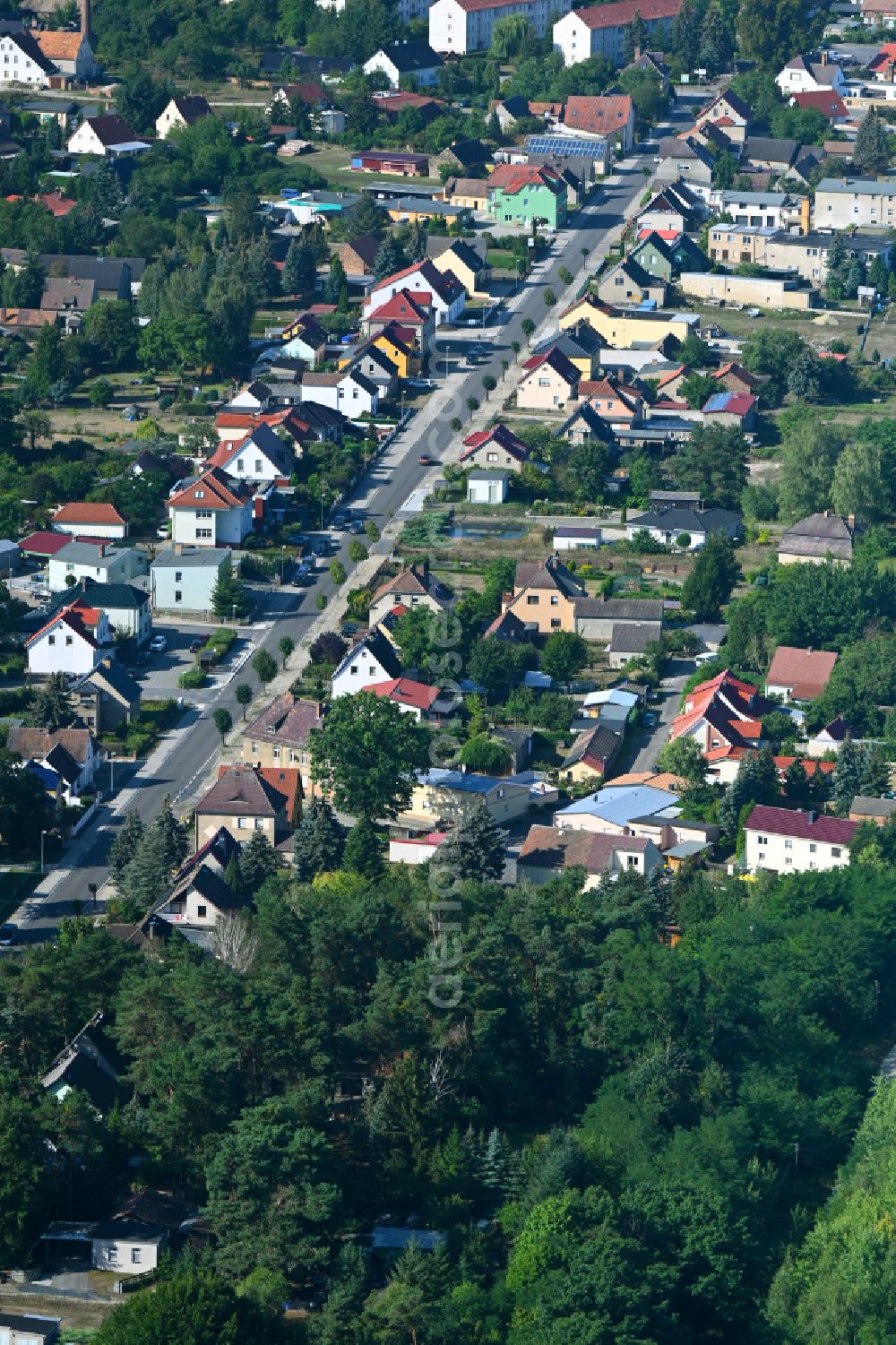 Crinitz from the bird's eye view: Town View of the streets and houses of the residential areas along the main street in Crinitz in the state Brandenburg, Germany