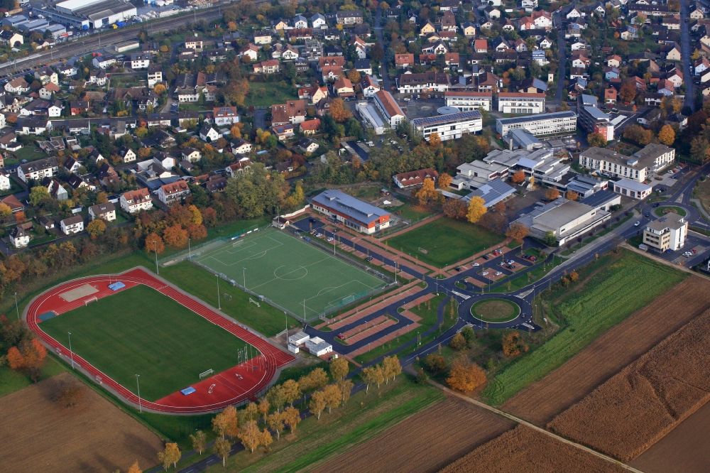 Aerial image Efringen-Kirchen - Town view of the streets and houses in the town center, at the sports facilities, the school center, the development area Giessenfeld and the community center with residential areas in Efringen-Kirchen in the state of Baden-Wuerttemberg