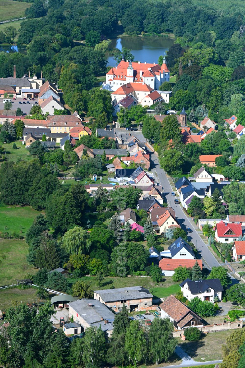 Luckau from above - City view of the streets and houses of the residential areas along the Alte Calauer Strasse and moated castle in Fuerstlich Drehna in the state Brandenburg, Germany