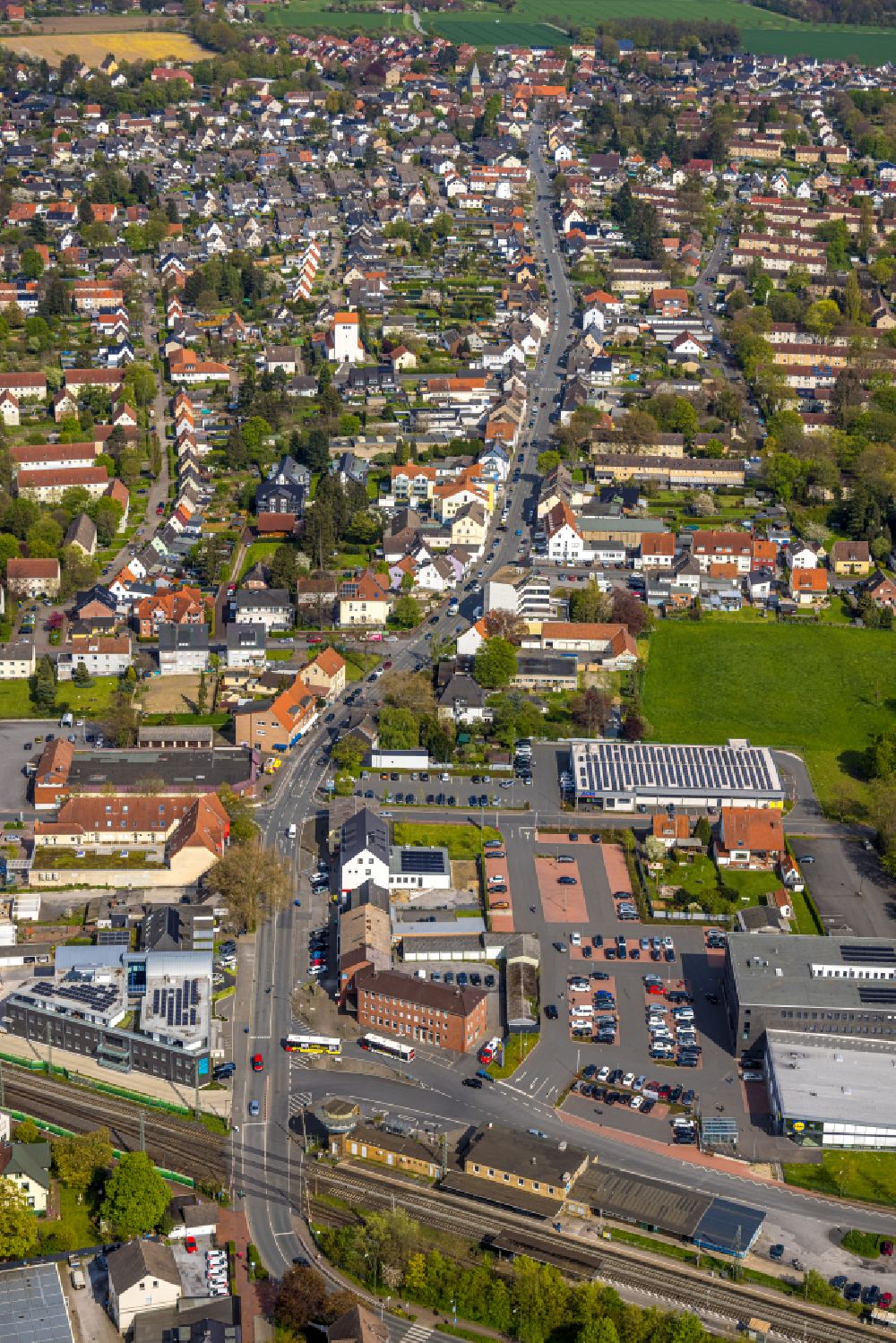 Bönen from the bird's eye view: Town View of the streets and houses of the residential areas along Bahnhofstrasse in Boenen in the state North Rhine-Westphalia, Germany