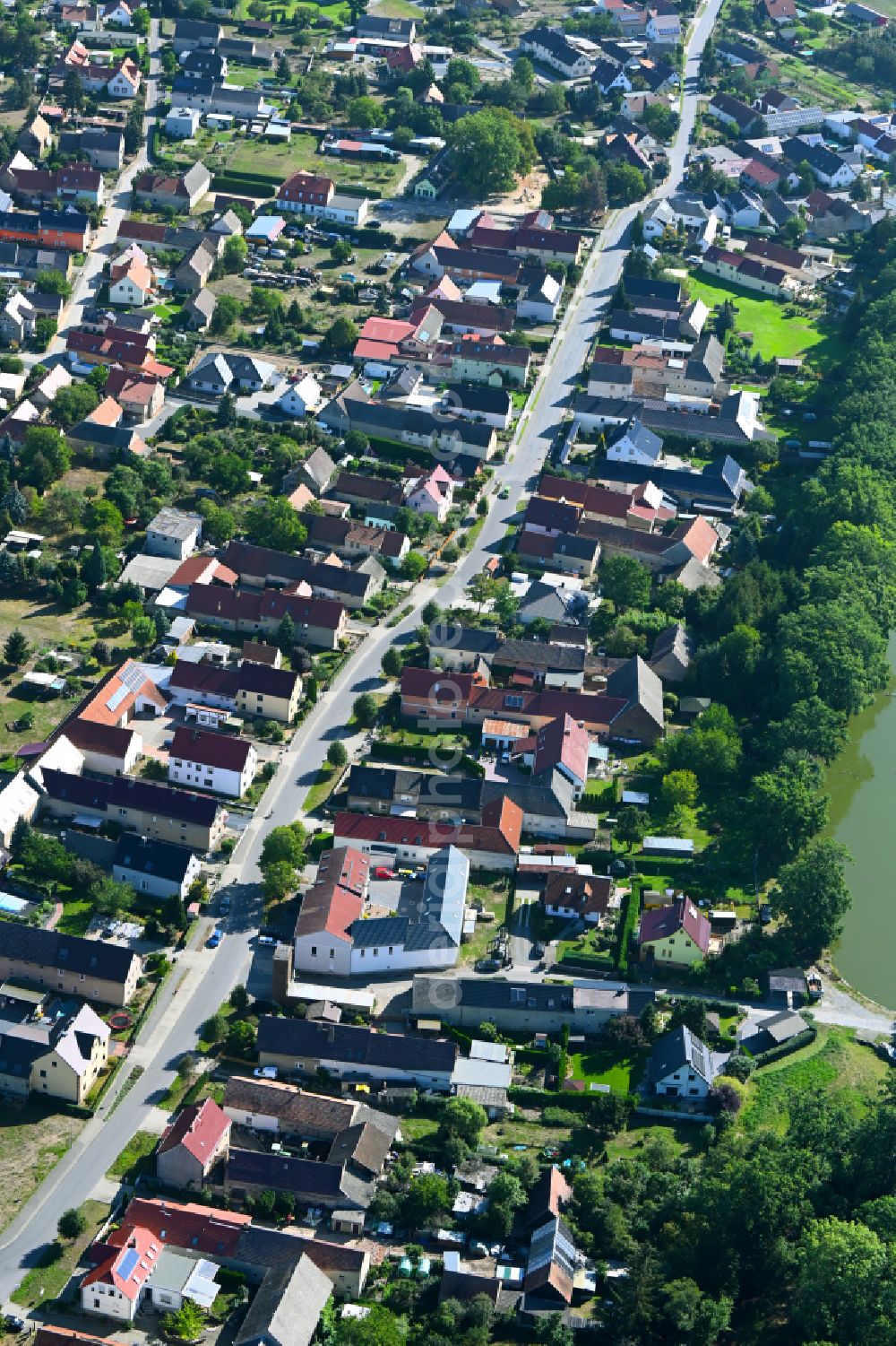 Aerial photograph Lindenau - Town View of the streets and houses of the residential areas along the main street in Lindenau in the state Brandenburg, Germany