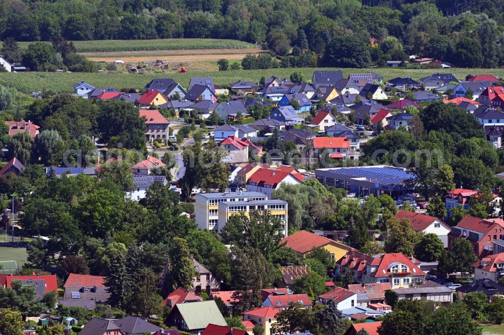 Mühlenbeck from the bird's eye view: Town View of the streets and houses of the residential areas in Muehlenbeck in the state Brandenburg, Germany