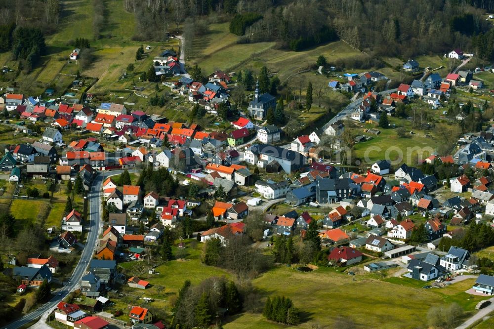 Möhrenbach from the bird's eye view: City view of the streets and houses of the residential areas in the landscape surrounded by mountains and forest in Moehrenbach in the state Thuringia, Germany
