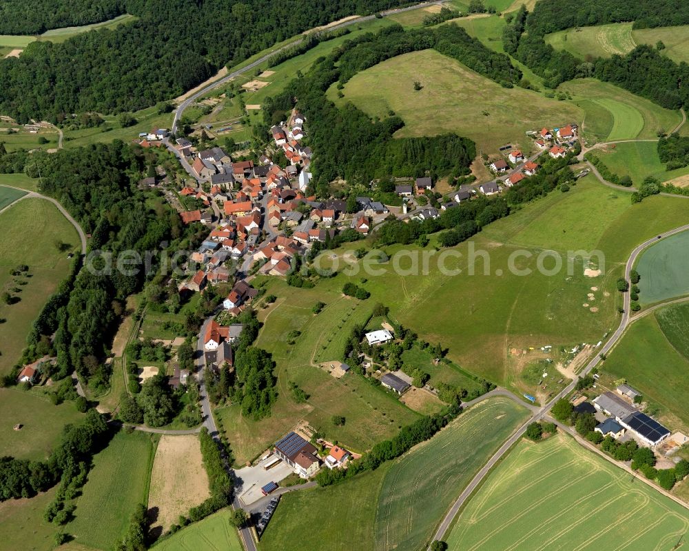Abtweiler from above - View of the borough and municipiality of Abtweiler in the state of Rhineland-Palatinate. The agricultural borough is located in the county district of Bad Kreuznach. Surrounded by fields, hills and forest, the village is located in the mountain range of Northern Palatinate