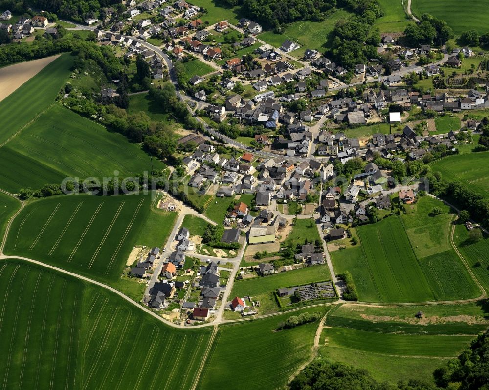 Glees from the bird's eye view: View of the borough of Glees in the state of Rhineland-Palatinate. Glees is an official tourist resort and is located in a valley of the Eifel region. It is surrounded by hills, fields and wooded areas