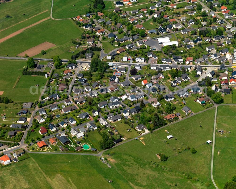 Aerial photograph Rehe - View of the borough of Rehe in the state of Rhineland-Palatinate. The borough is located in the county district and region of Westerwald. The residential village is surrounded by fields and meadows and sits on federal highway B255