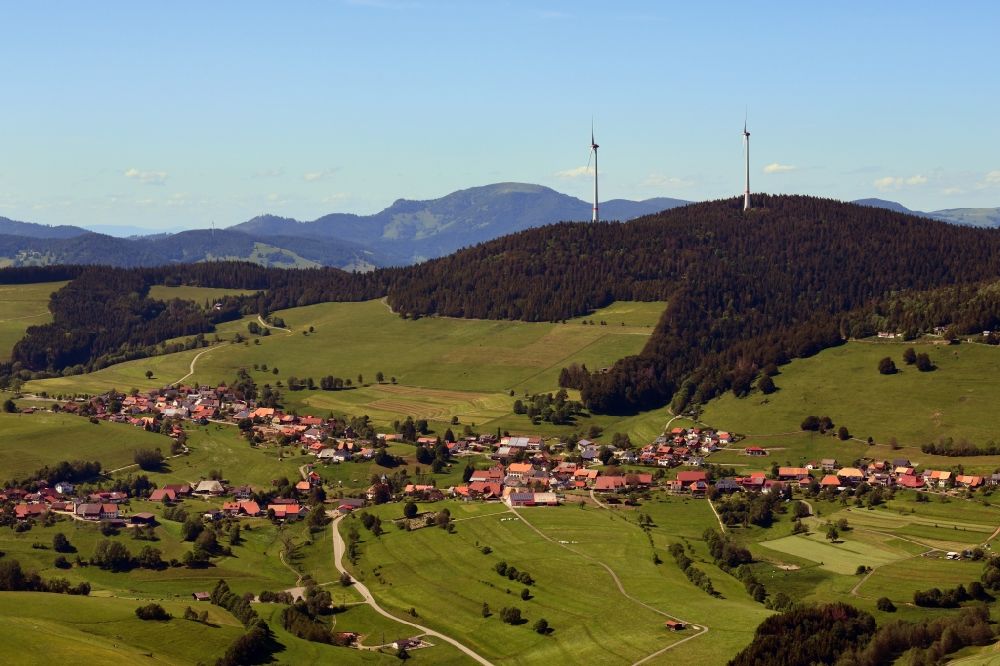 Schopfheim from above - City view of the district Gersbach in the Black Forest with silhouette of a group of wind power plants on the mountain Rohrenkopf in Schopfheim in the state Baden-Wurttemberg, Germany